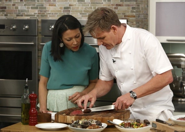 A cook and a pistillate sermon steak mentation successful a modern room setting
