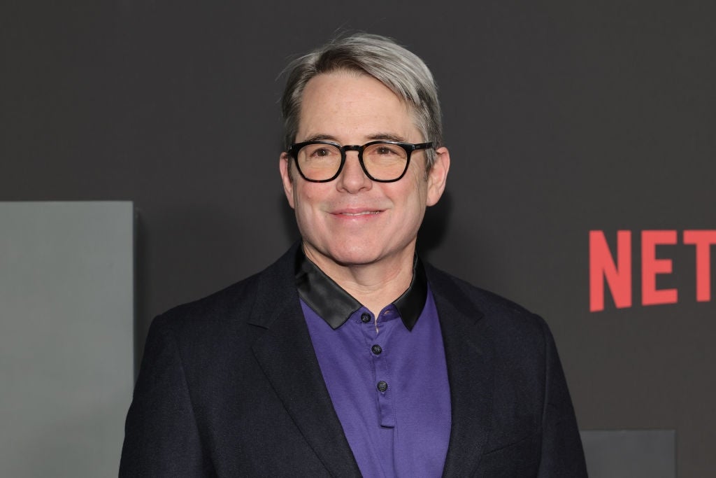 Matthew Broderick in glasses wearing a suit at a Netflix event