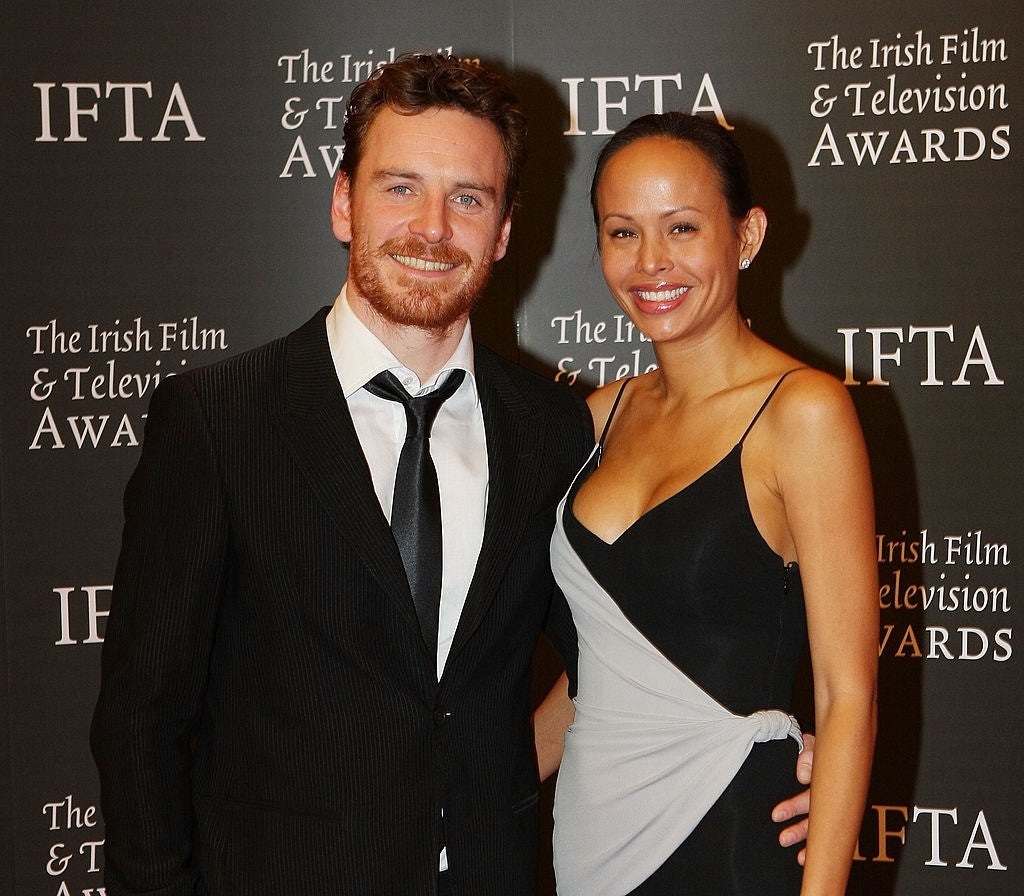 Michael Fassbender poses with Leasi Andrews at an event