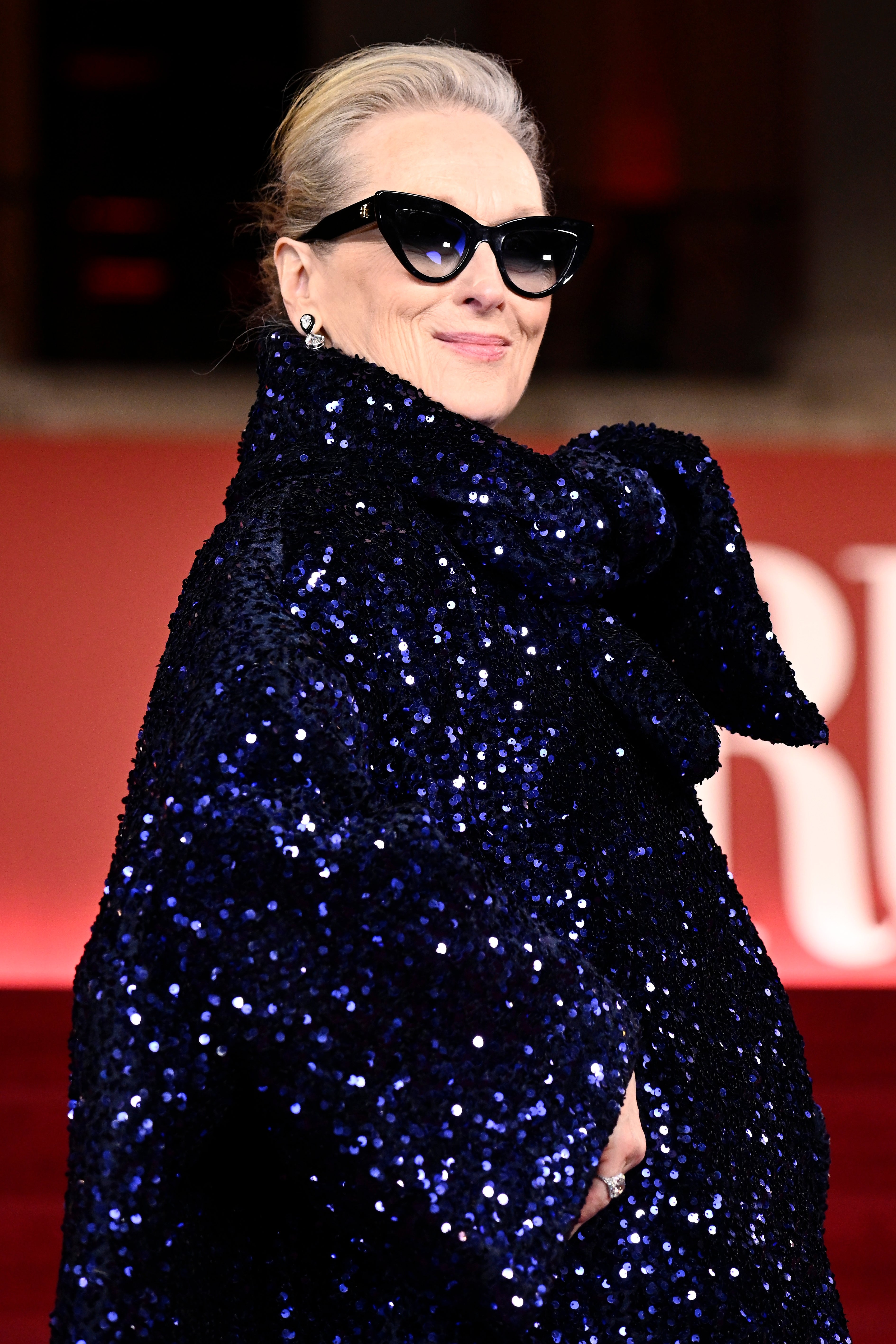 Meryl Streep on the red carpet, wearing a sparkly outfit
