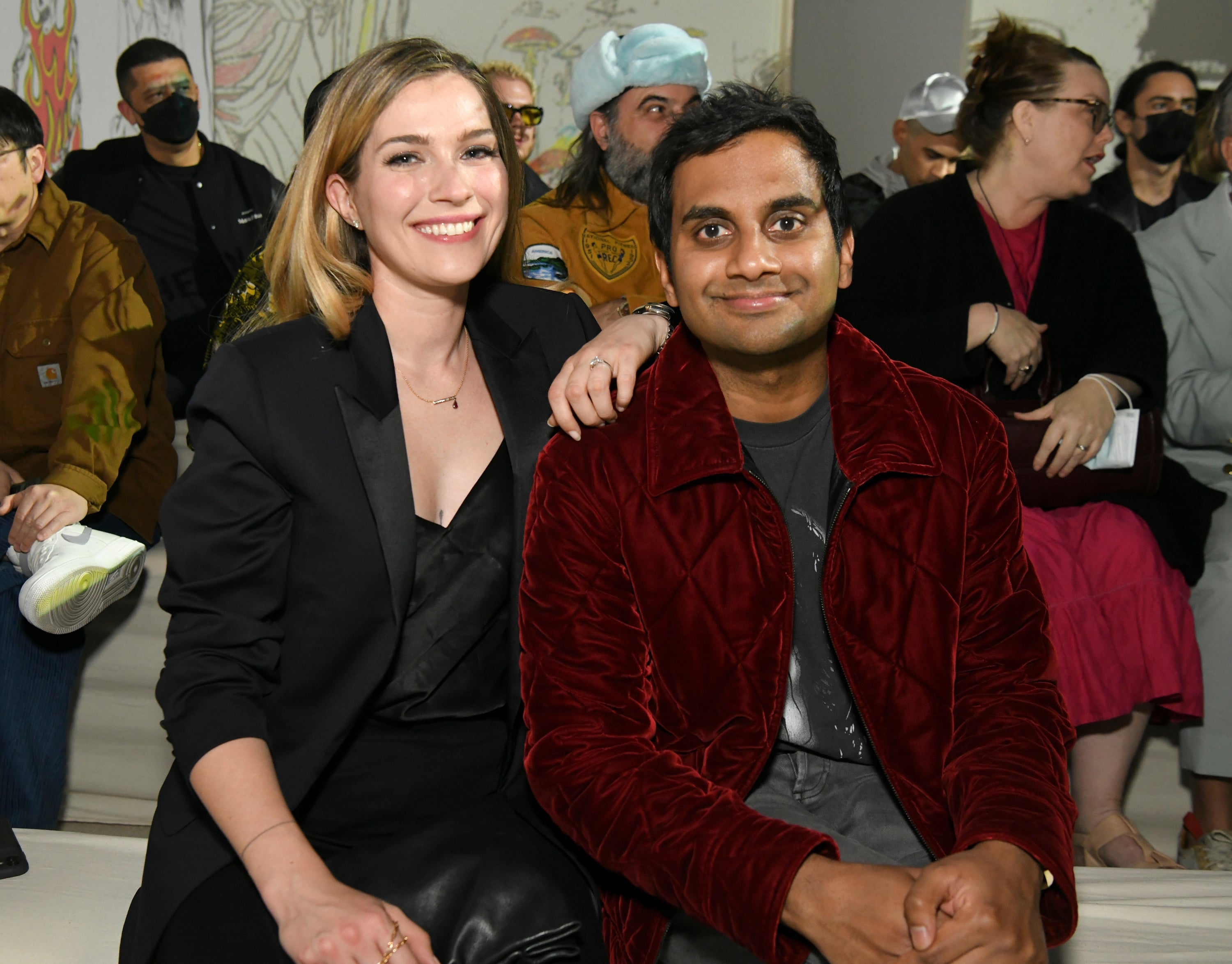 Serena Skov Campbell and Aziz Ansari seated at an event