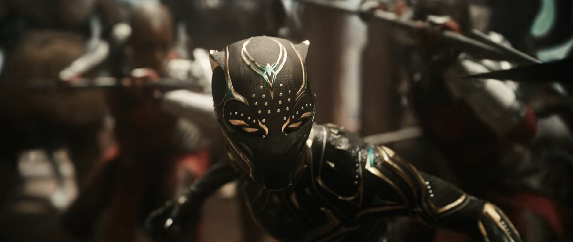 Character in a sleek, stylized suit resembling a panther, poised in action with others in similar costumes in the background