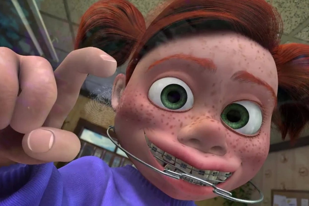 Animated character with braces and pigtails presses face against glass, smiling