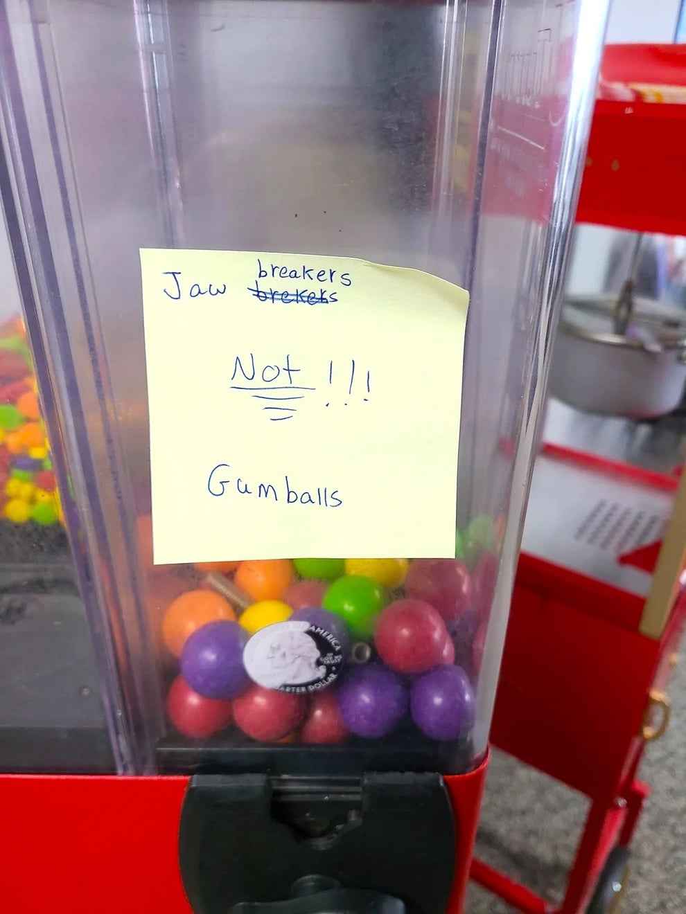 Sign on a gumball machine reads: "Jaw breakers, not gumballs!!!"