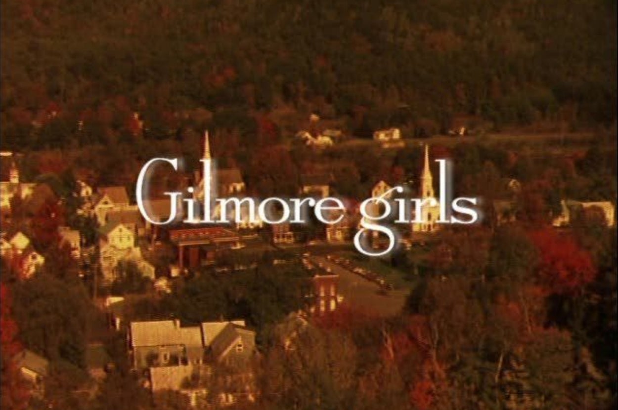 Gilmore Girls opening scene with a view of Stars Hollow, featuring the show's title in the center