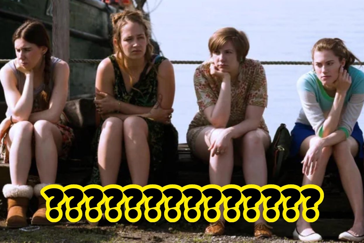 Four people sit on a dock, looking contemplative with their chins on their hands