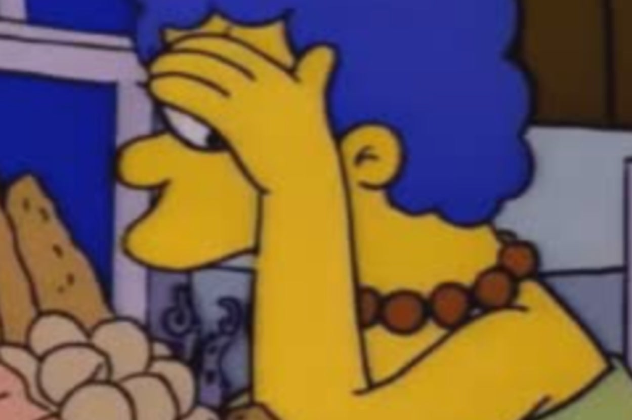 Animated character with blue hair and a beaded necklace holds head in hand, looking at groceries
