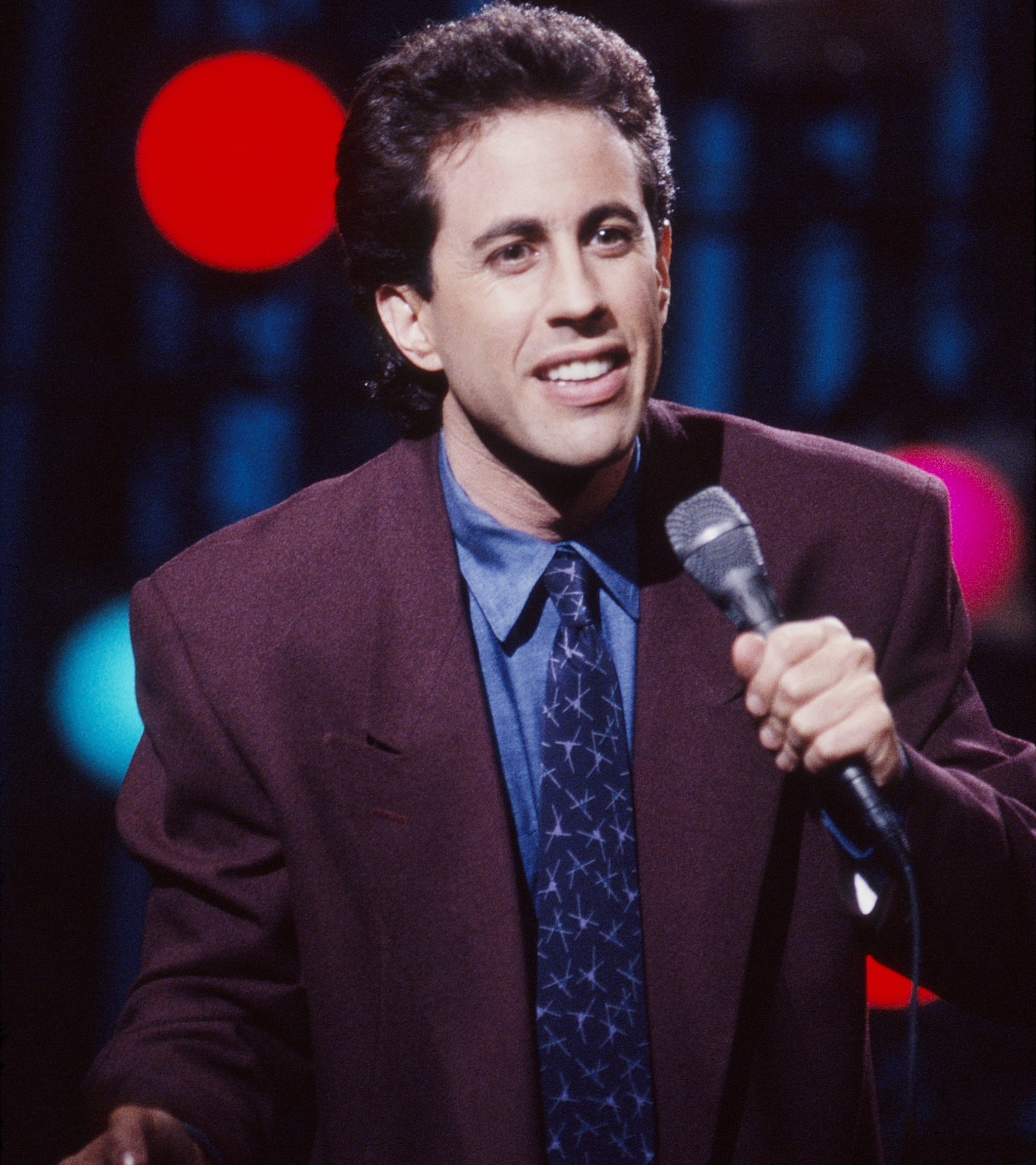 Jerry Seinfeld in the show Seinfeld performing stand-up comedy