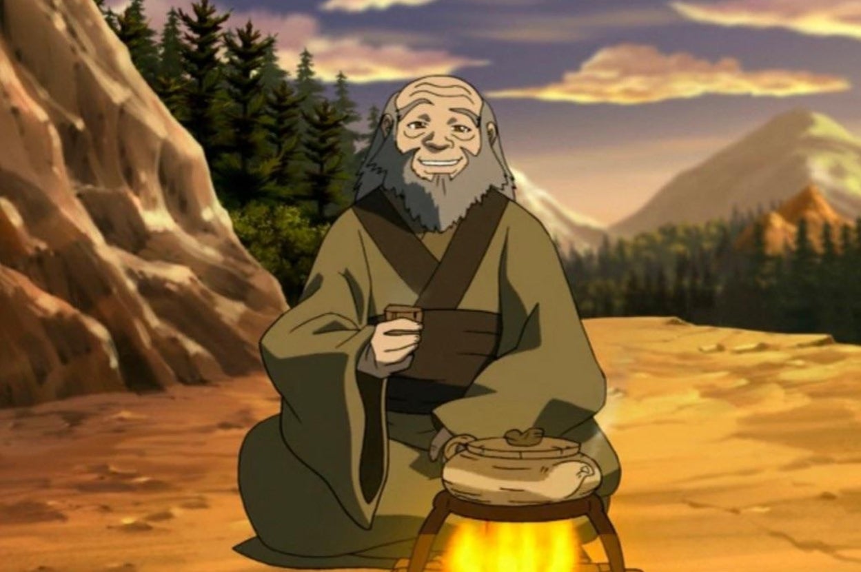 Animated older man with a beard sitting by a campfire in a mountainous landscape, holding a cup and smiling