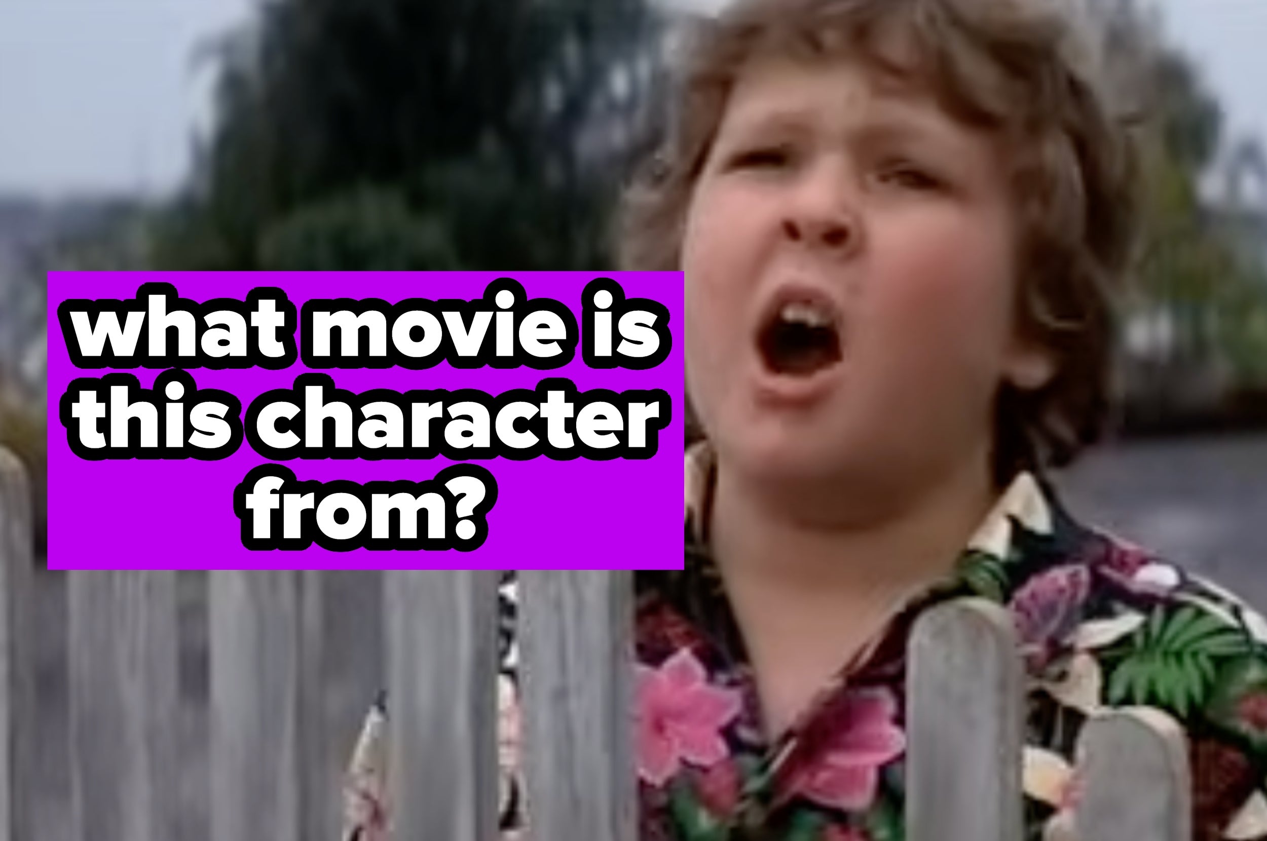 Child actor with curly hair, wearing a floral shirt, stands behind a fence. Text asks, "What movie is this character from?"