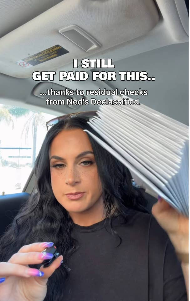 Jennifer Hyatt Tedmori in a car holding a stack of papers, with text indicating they get paid from residual checks for Ned's Declassified