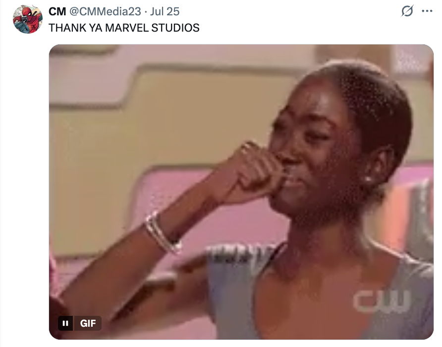 Person smiling and wiping away a tear in a heartfelt moment, with the caption "THANK YA MARVEL STUDIOS" above
