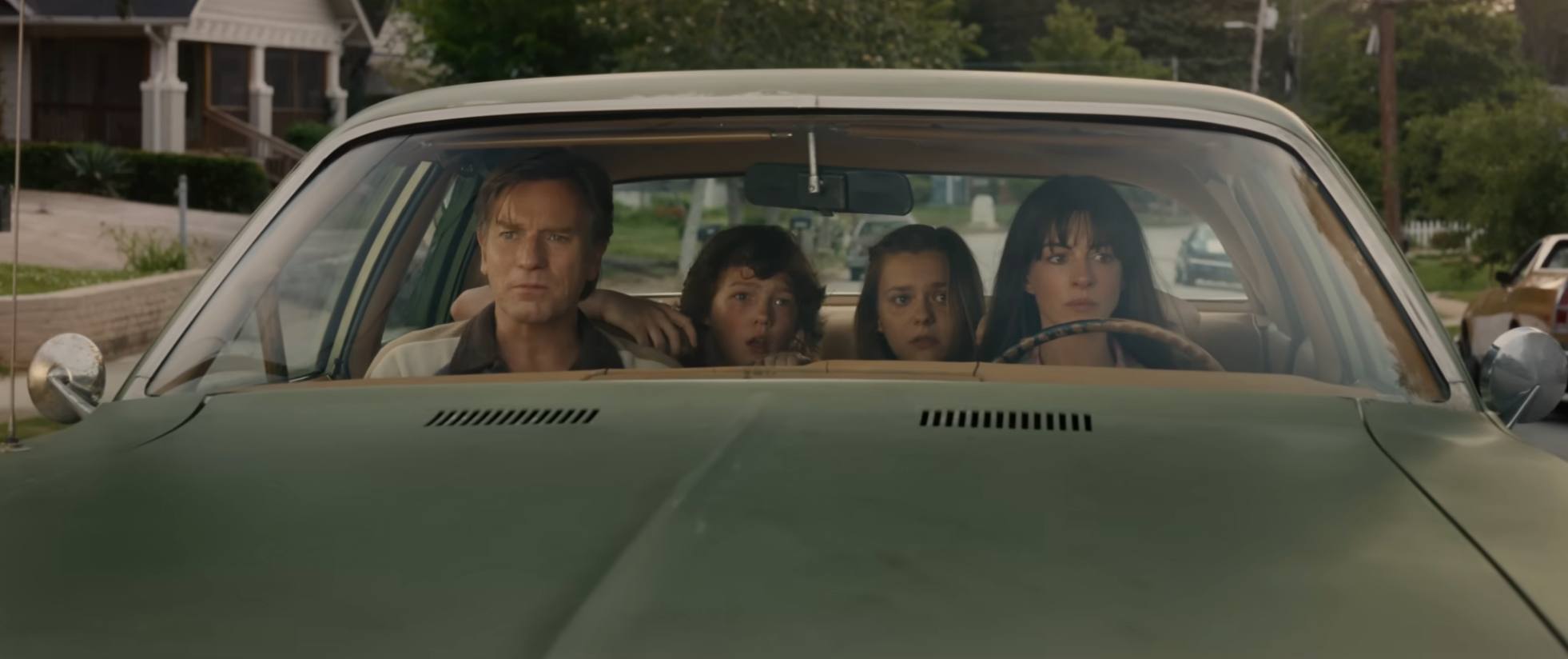 Four people sitting in a car in "The End of Oak Street"