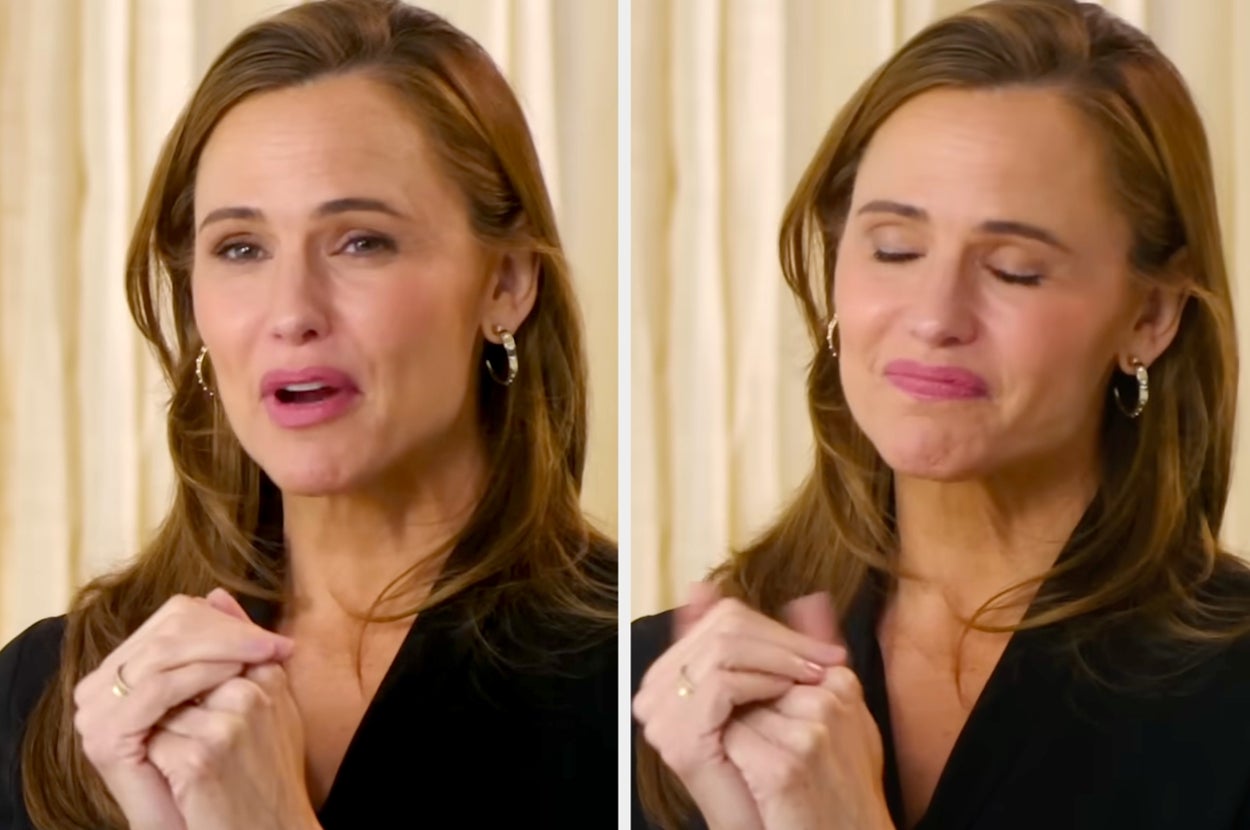 A person in a heartfelt moment, with clasped hands and closed eyes, wearing a sleek black outfit and hoop earrings
