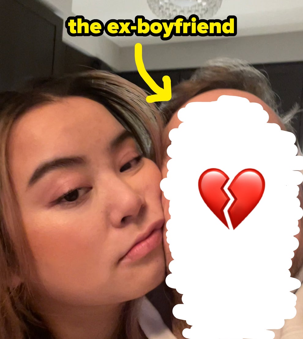 A couple taking a close-up selfie, with one person gently resting their head on the other's cheek, both appear relaxed and content