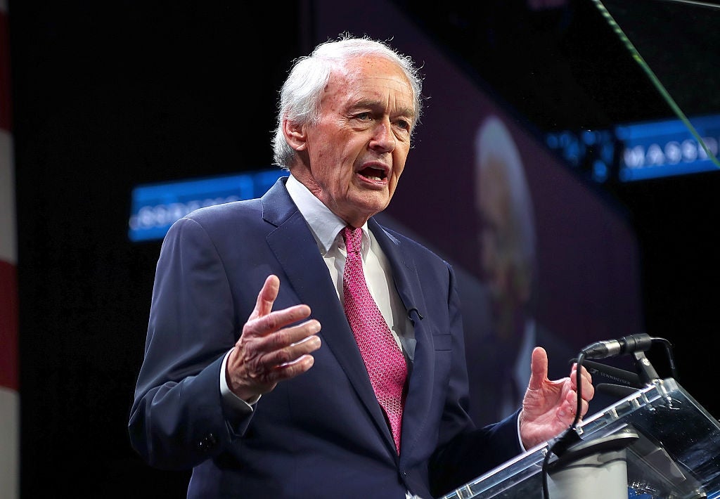 Ed Markey in a suit and tie speaks passionately at a podium during a public event