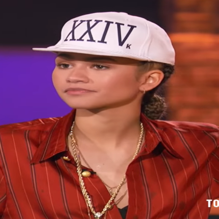 Person in a striped shirt and hat on a television set, promoting "Lip Sync Battle" on MTV
