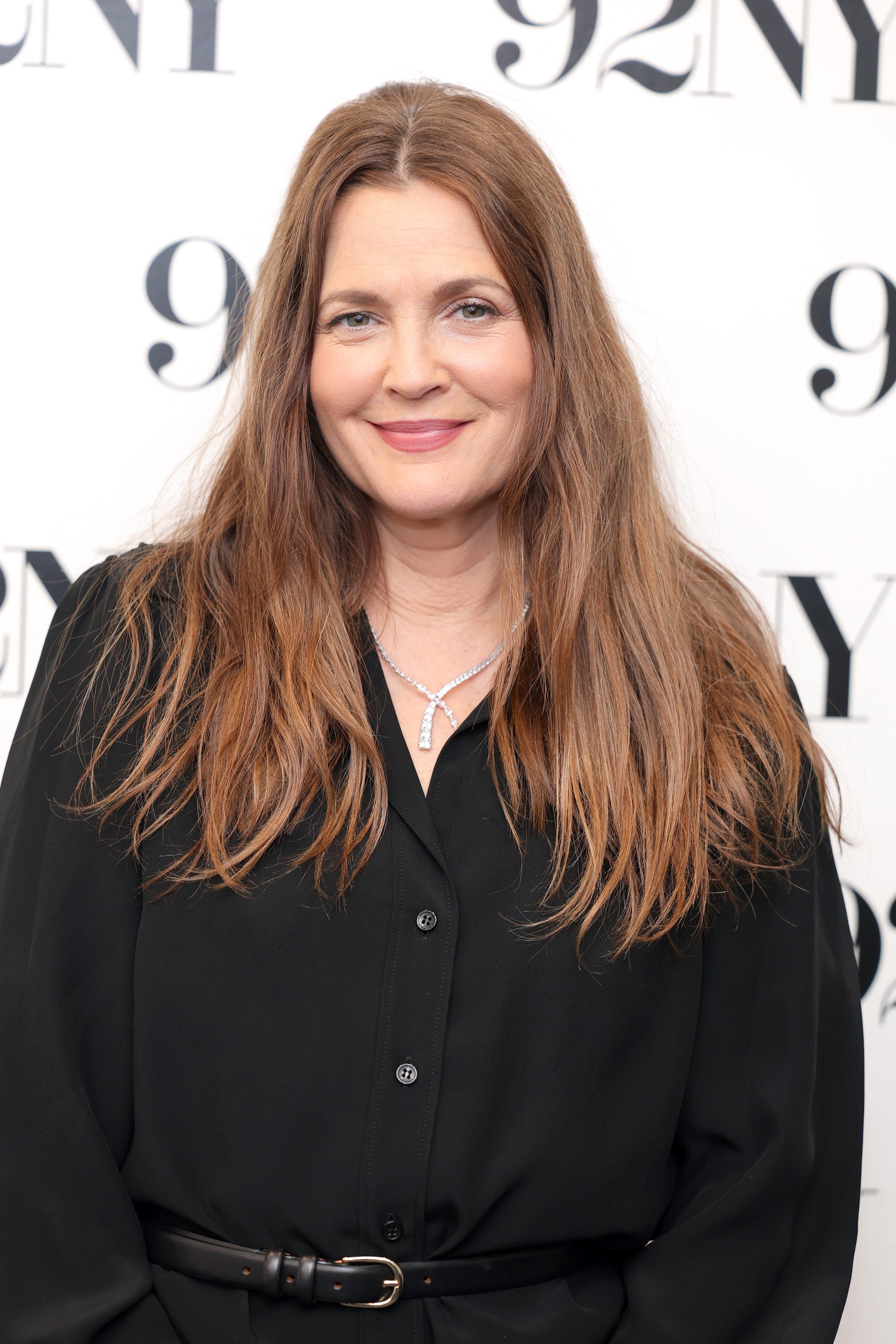Drew Barrymore wearing a black outfit on the red carpet