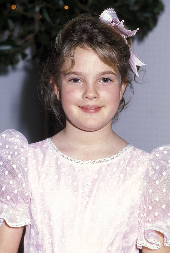Drew Barrymore wearing a polka dot dress in 1984