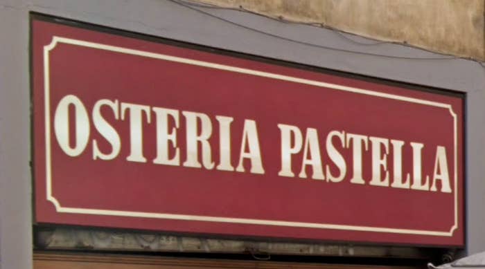 Sign for "Osteria Pastella," indicating a restaurant, possibly a travel destination or dining recommendation