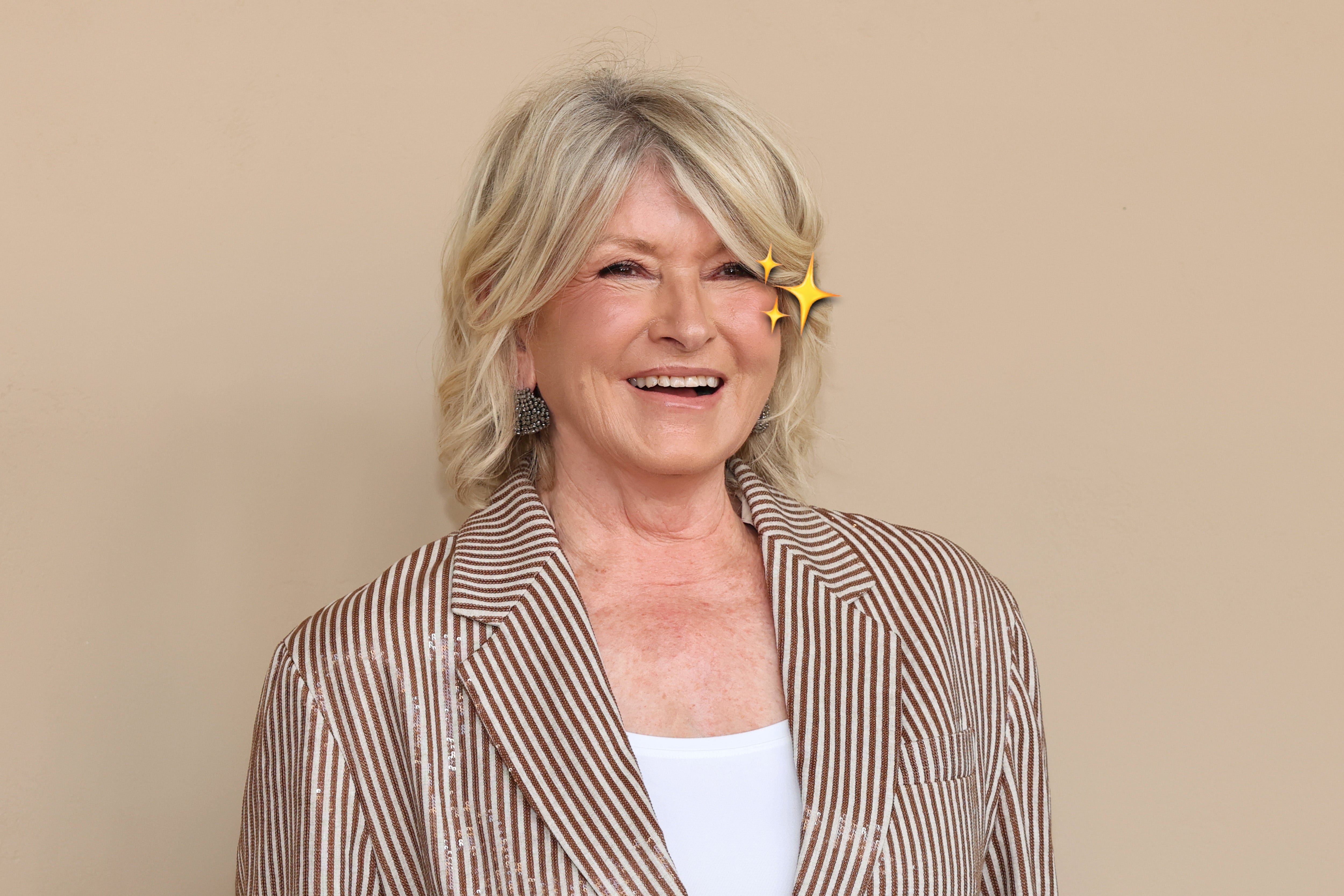 Close-up of Martha Stewart smiling with a sparkle emoji on her cheek