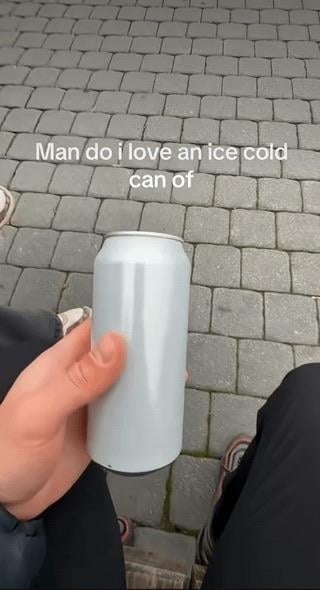 A person holds a plain can with text above reading, "Man do I love an ice cold can of."