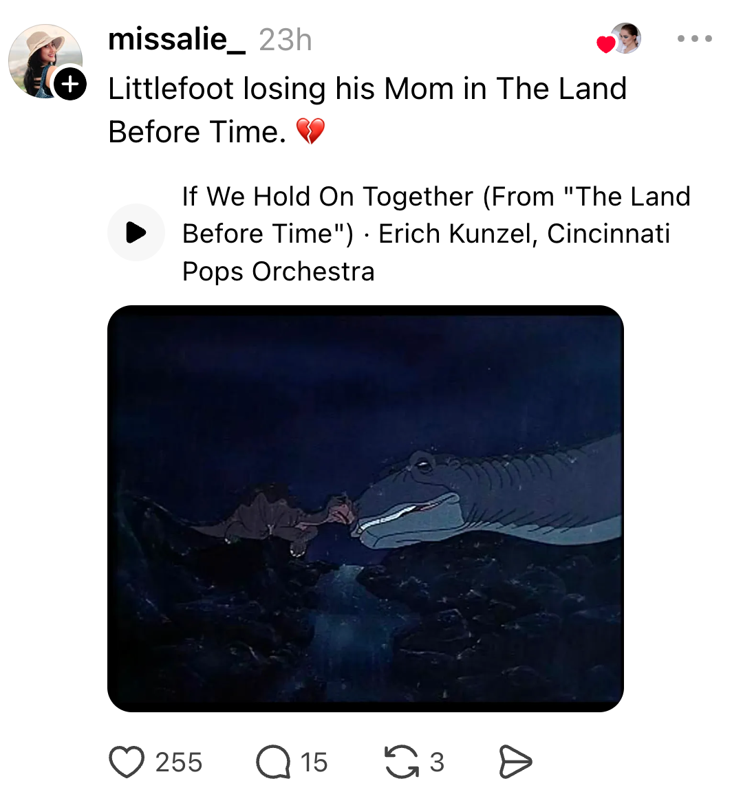 Scene from "The Land Before Time" showing Littlefoot with his mother, accompanied by a musical clip. Caption expresses loss and sadness