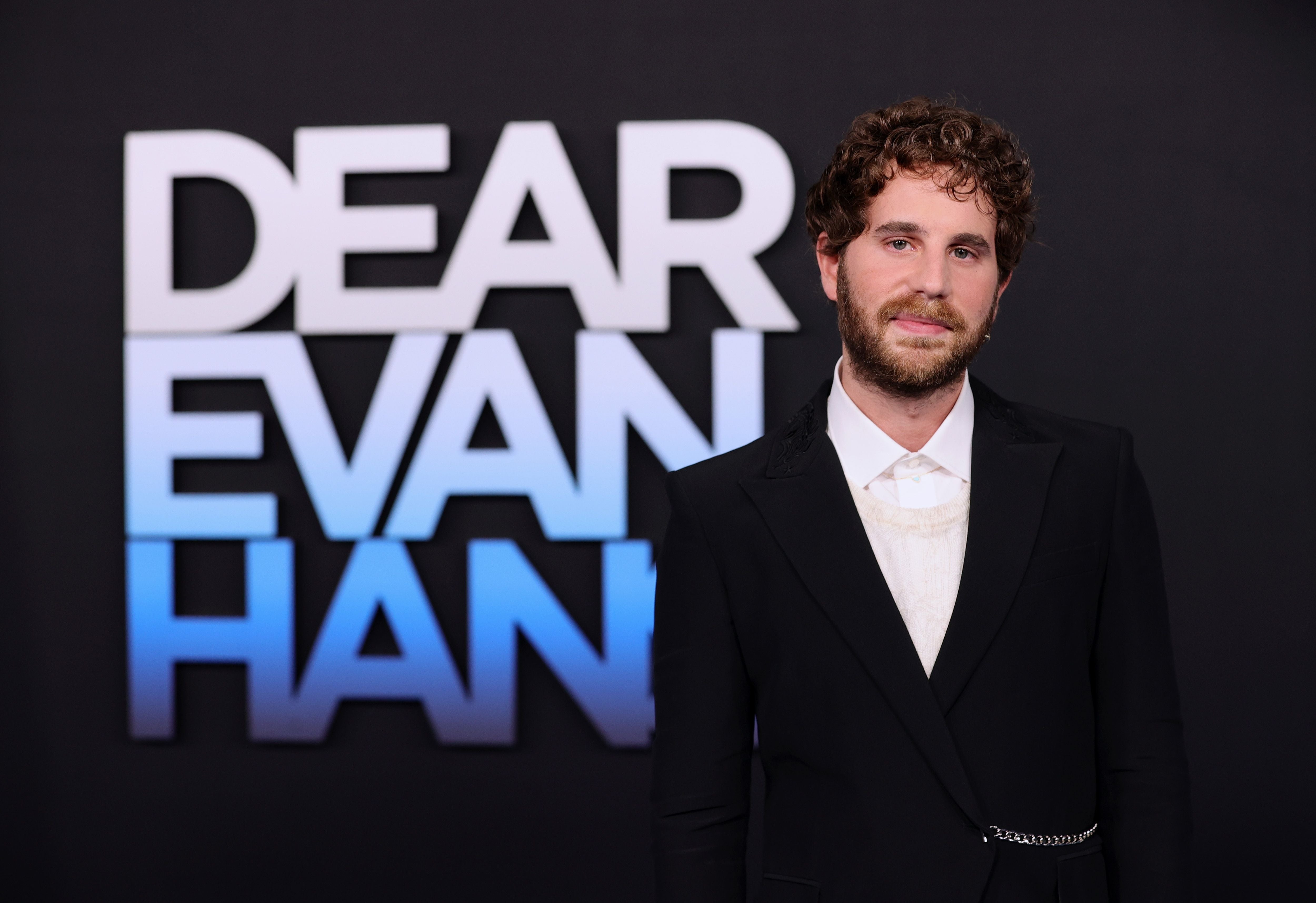 Platt in front of a "Dear Evan Hansen" backdrop at the film's premiere