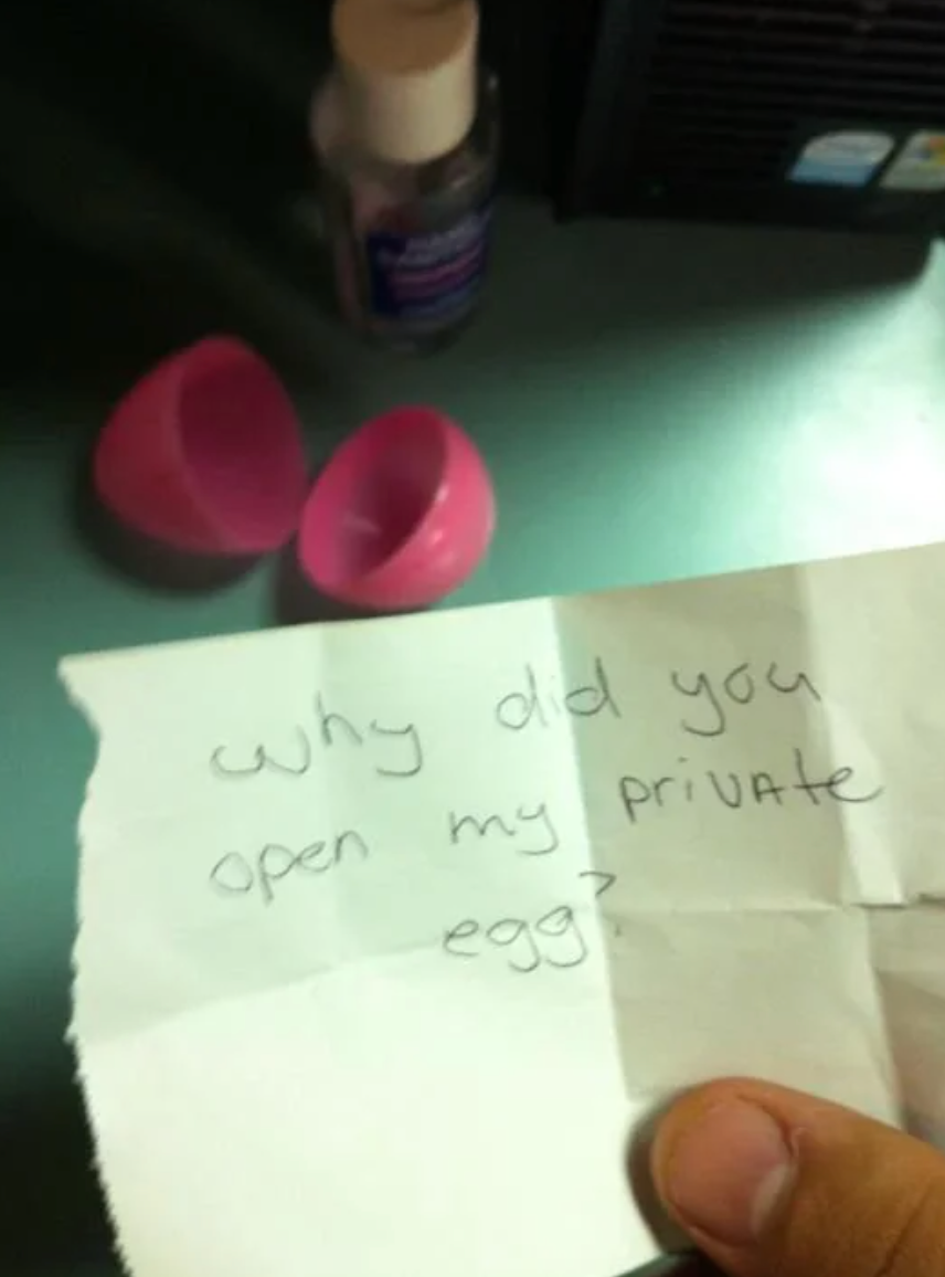 Note with handwritten message: "Why did you open my private egg?" nearby a split plastic egg