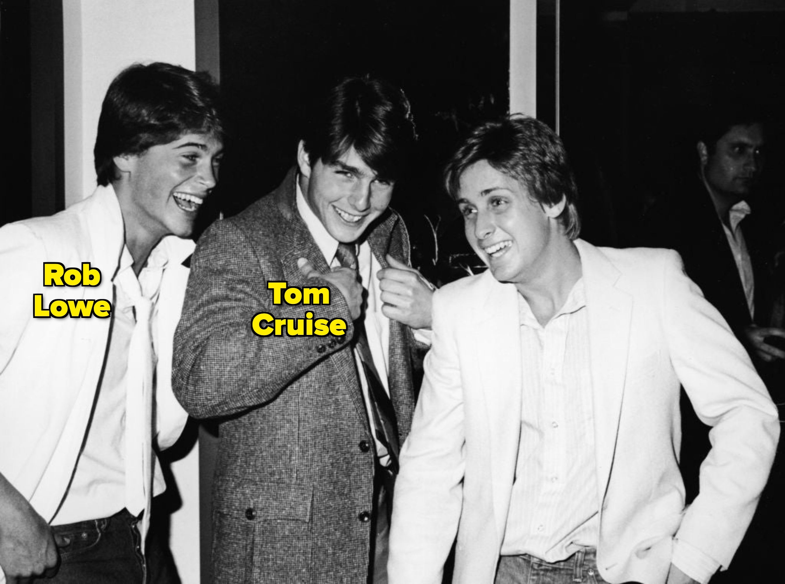 Rob Lowe, Tom Cruise, and Emilio Estevez smiling and laughing at a social event