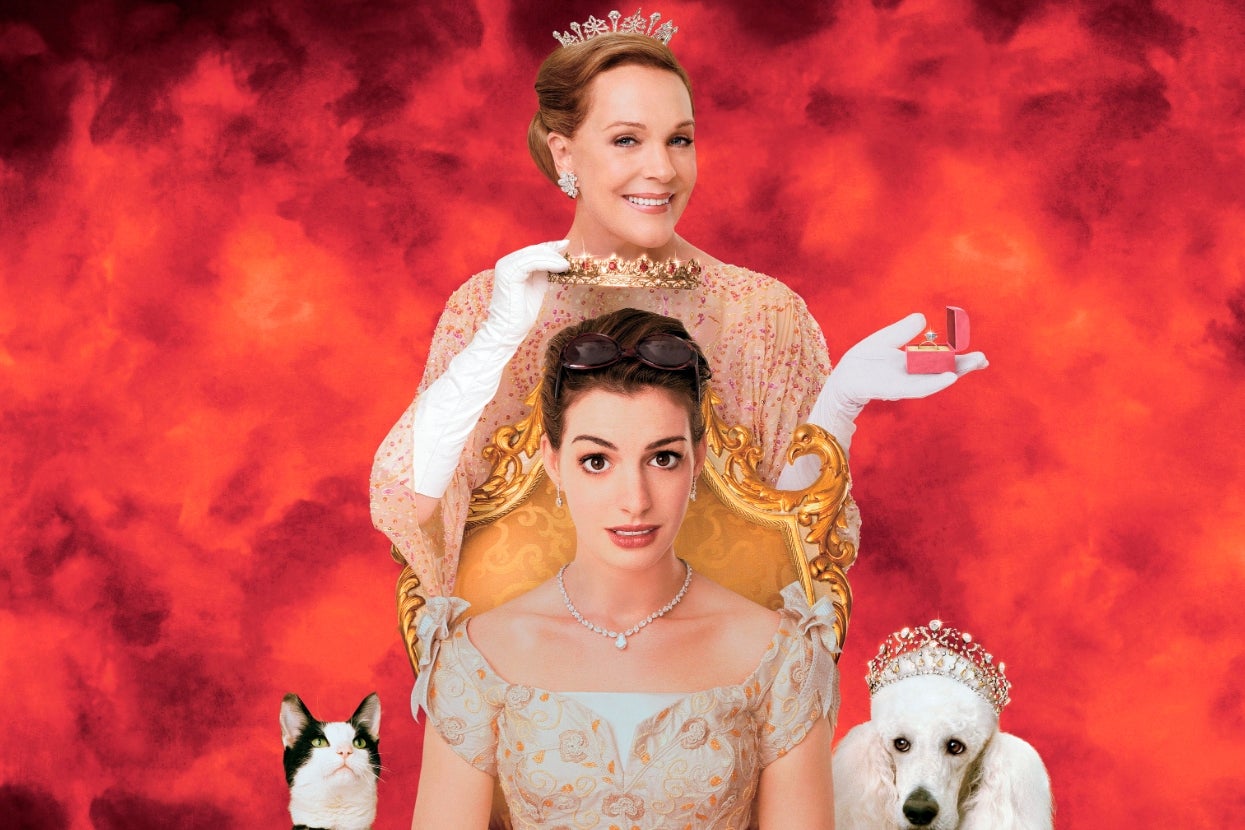 Two women wearing tiaras and elegant gowns, with a cat and a dog also wearing tiaras, set against a backdrop with a royal theme