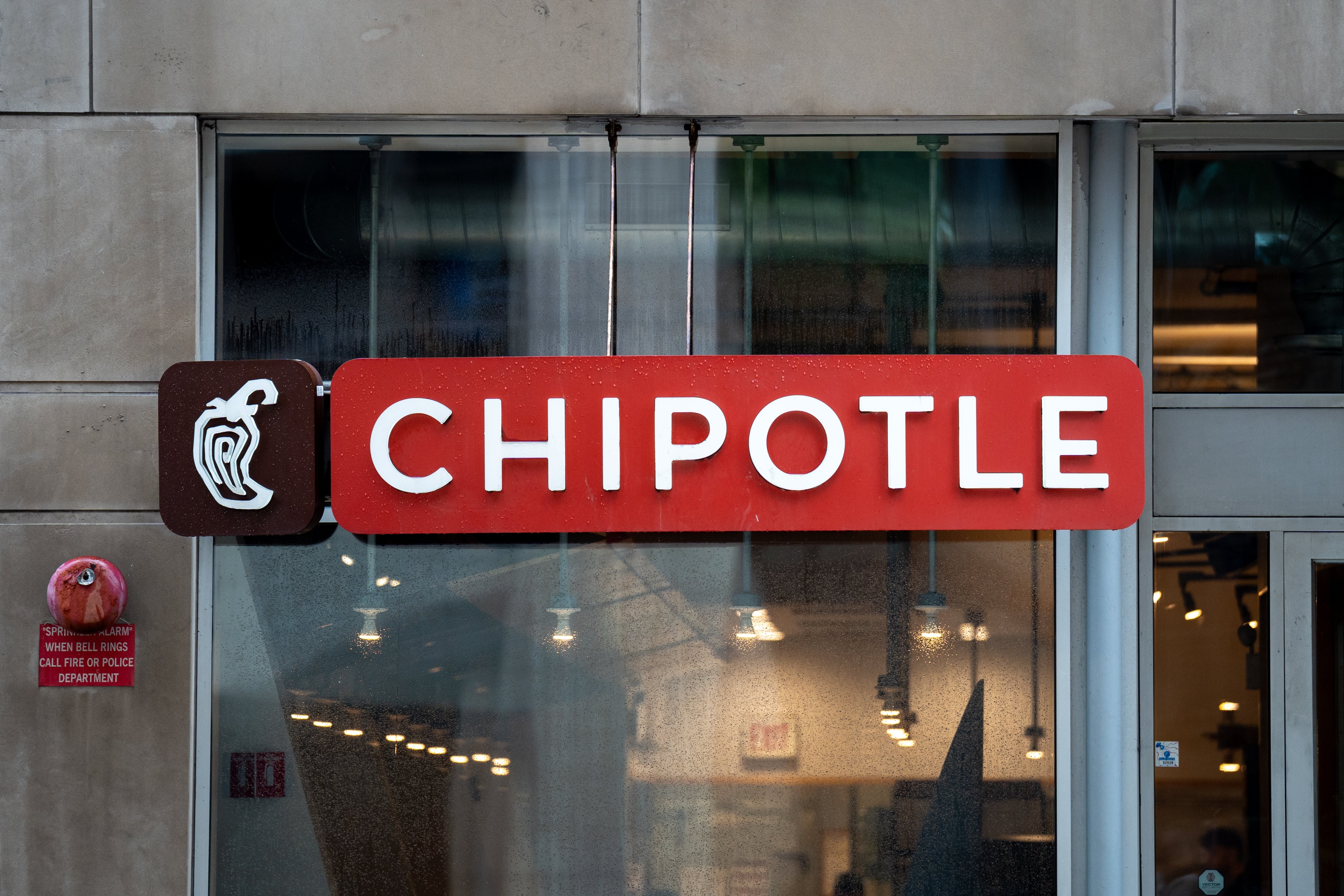 Chipotle edifice storefront with a disposable motion and a solid entranceway showing interior lighting