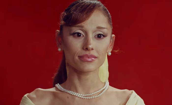 Ariana Grande wearing vintage attire and pearl accessories in her "Petal" music video