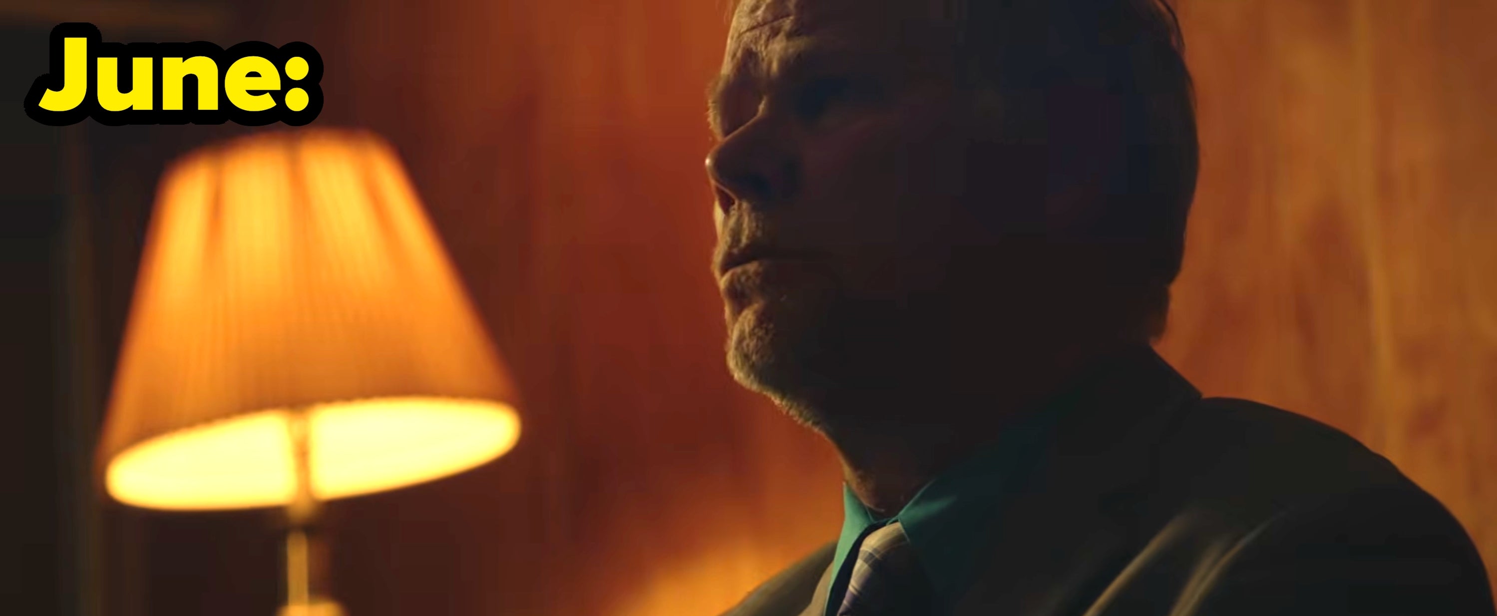 June's video, with a man in a suit sitting at a desk