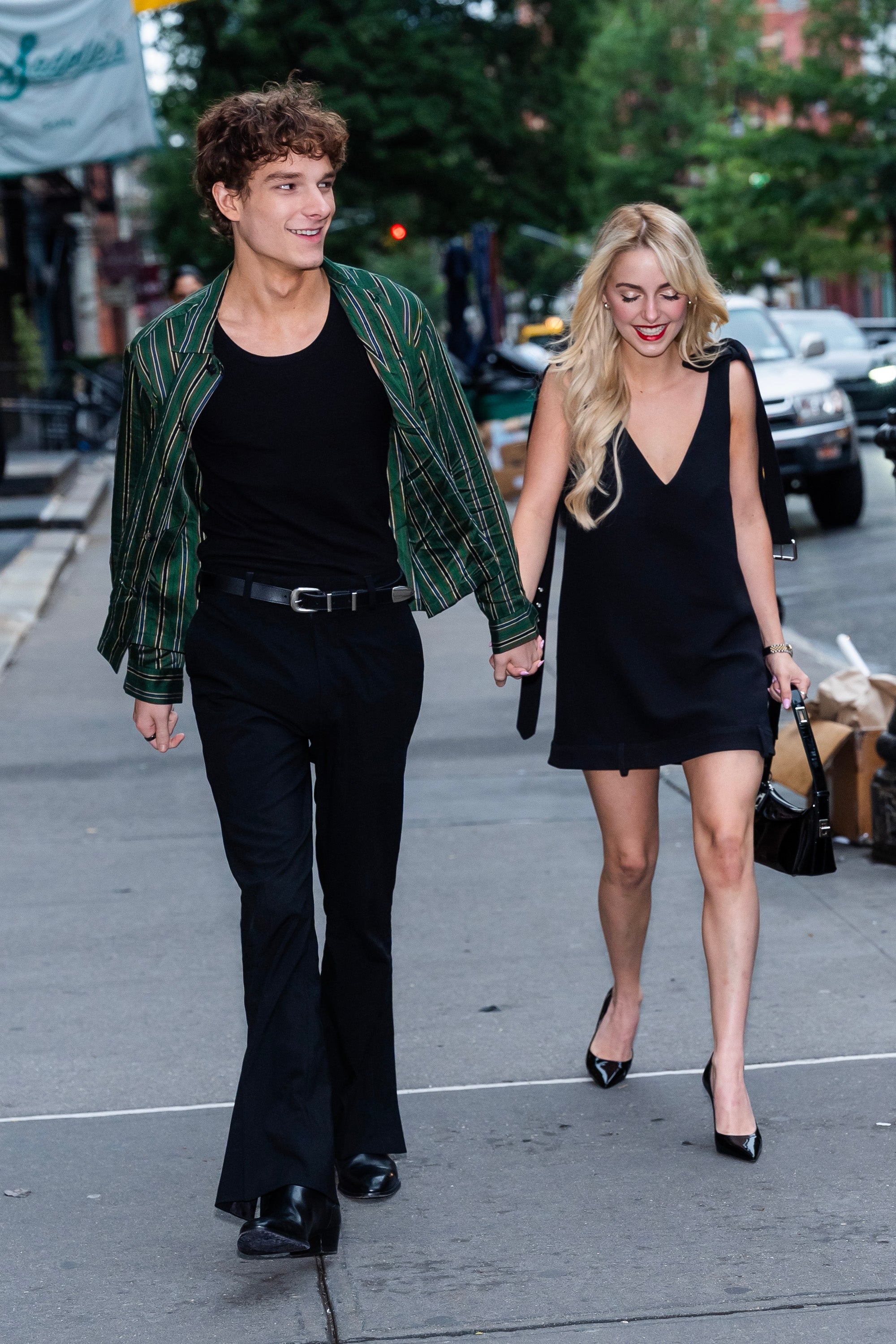 Mason Thames and McKenna Grace holding hands