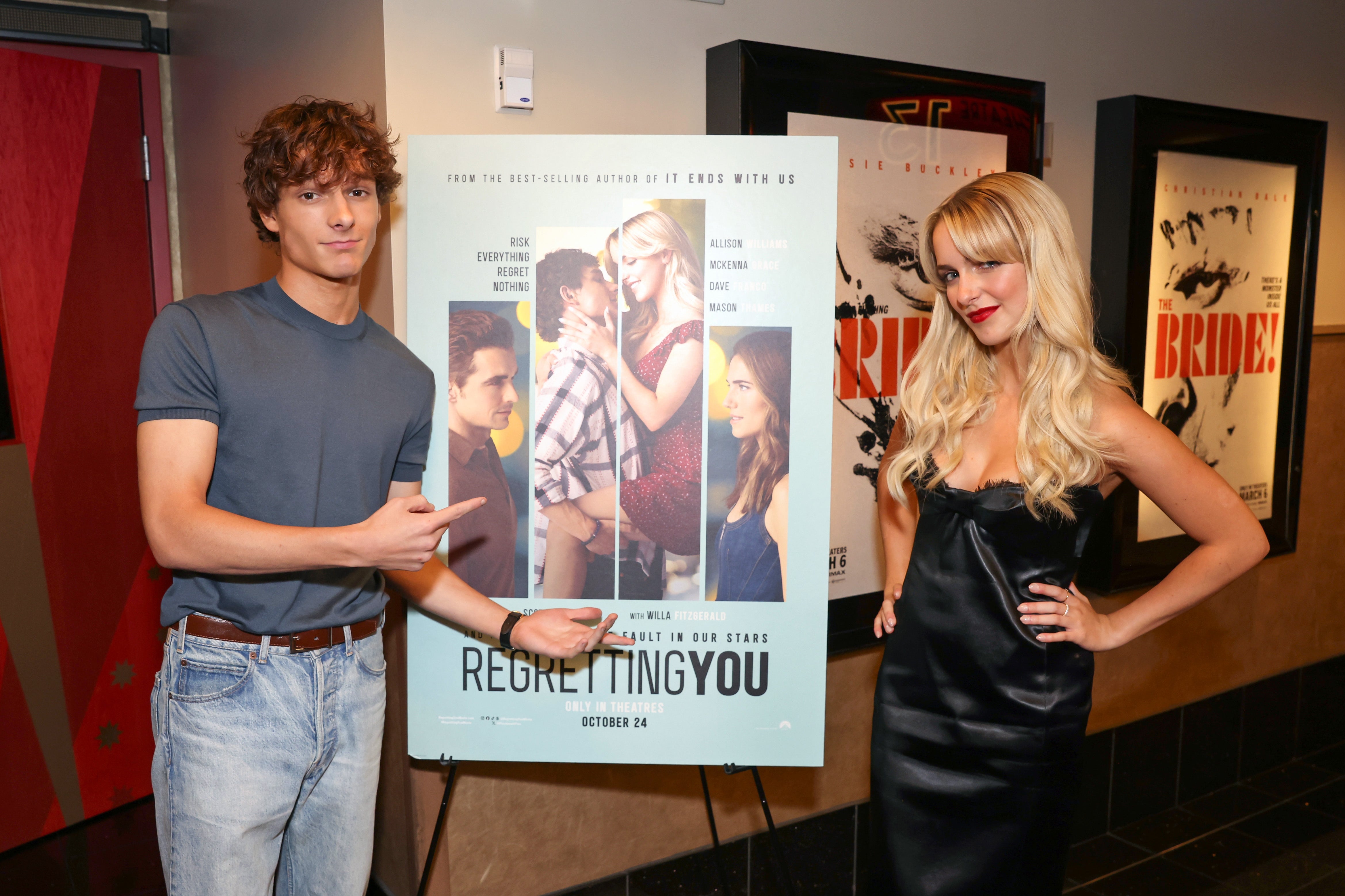 Mason Thames and McKenna Grace by a "Regretting You" poster