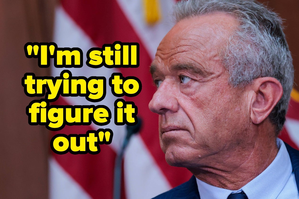 A person stands in front of a U.S. flag backdrop, looking thoughtful. Text reads, "I'm still trying to figure it out."
