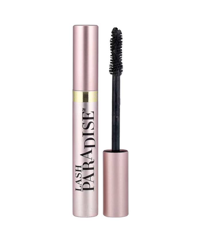 Mascara tube labeled "Lash Paradise" with an open applicator brush shown alongside for a shopping article