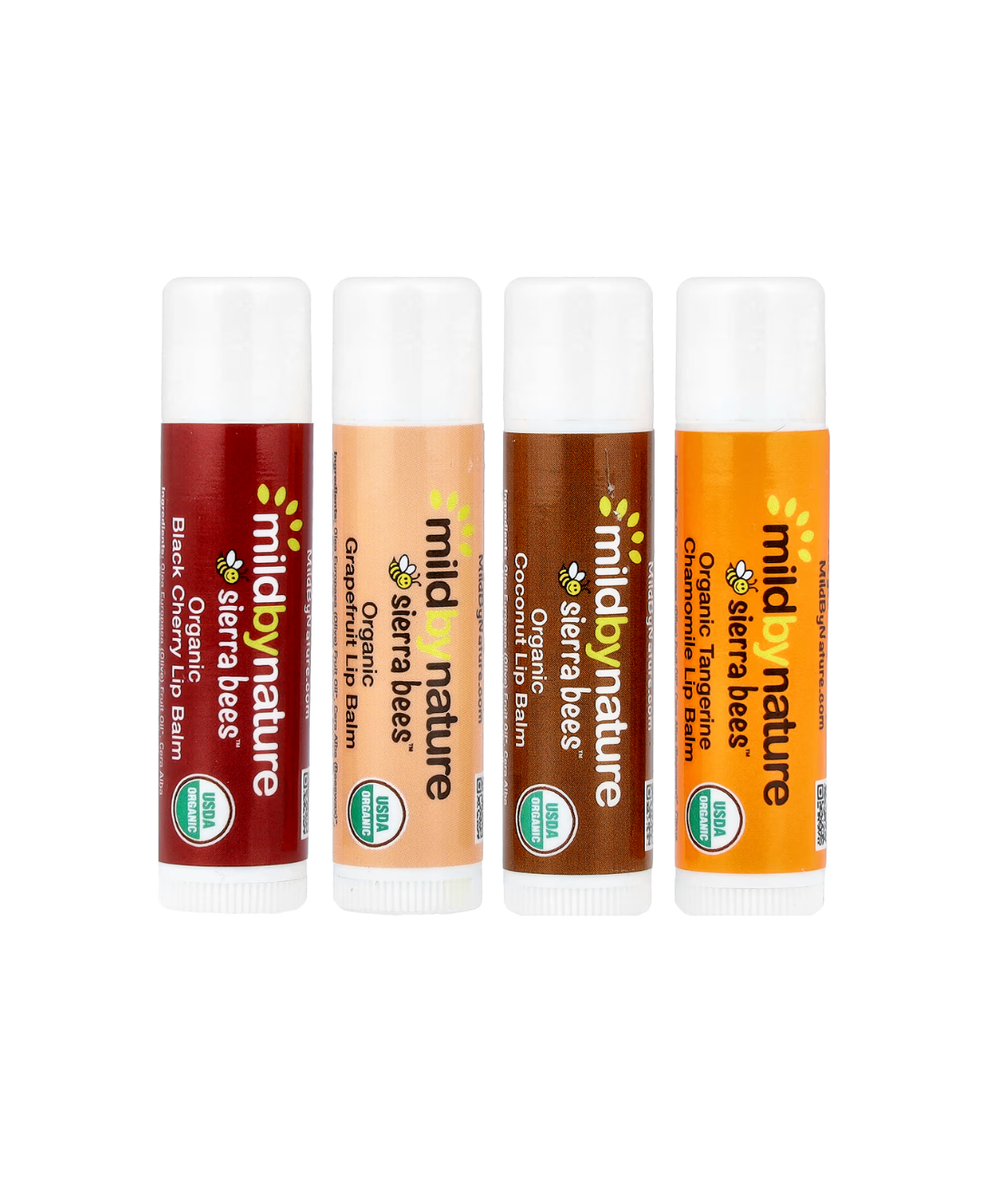 Four tubes of Sierra Bees lip balm in different flavors: Blackberry, Honey, Coconut, and Tangerine Chamomile