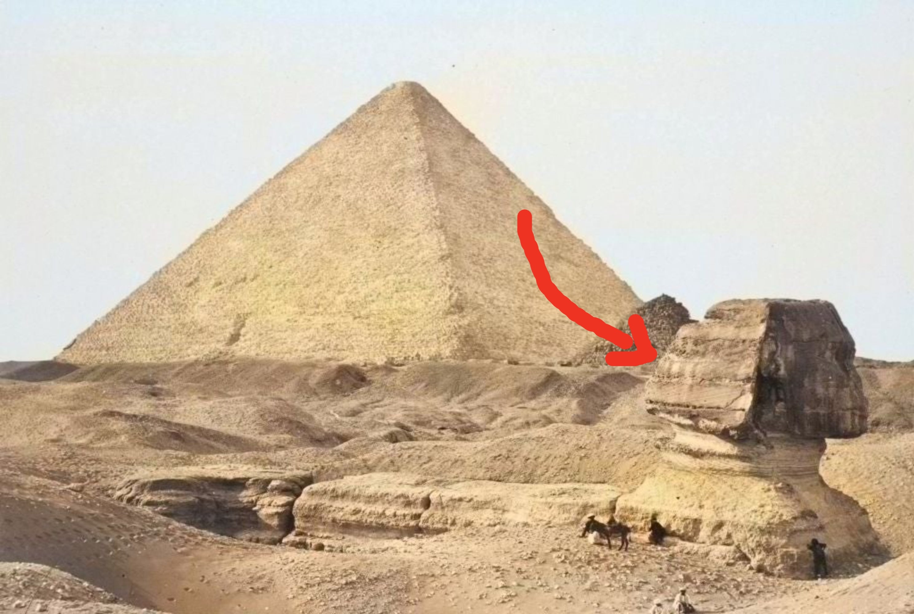 Pyramid and Sphinx in a desert landscape, with small figures on the ground