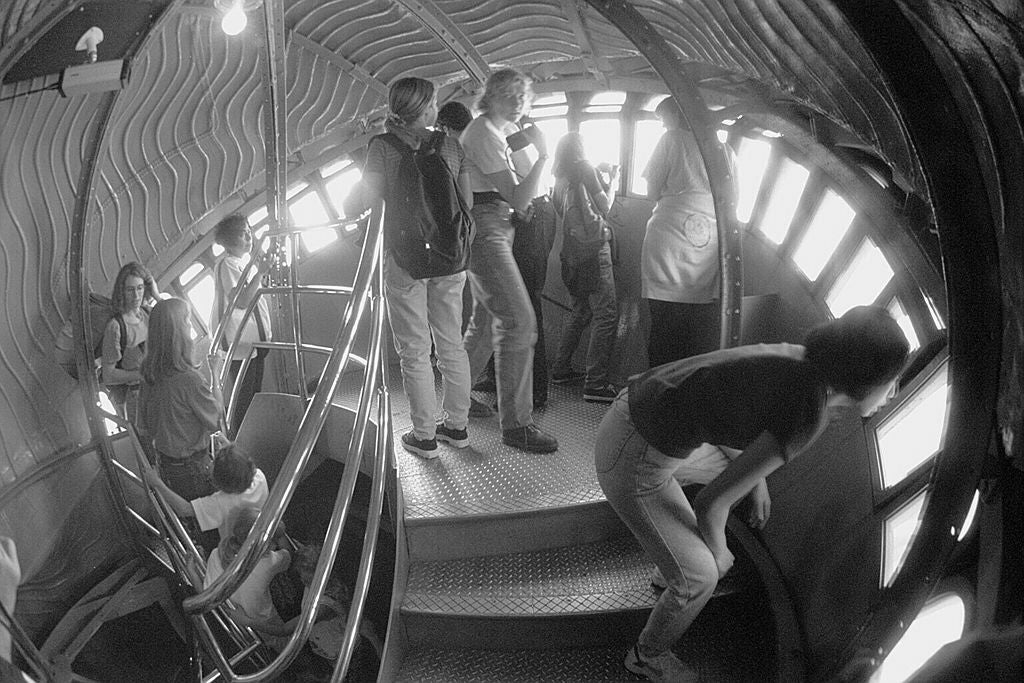 People inside the Statue of Liberty's crown looking out through the windows