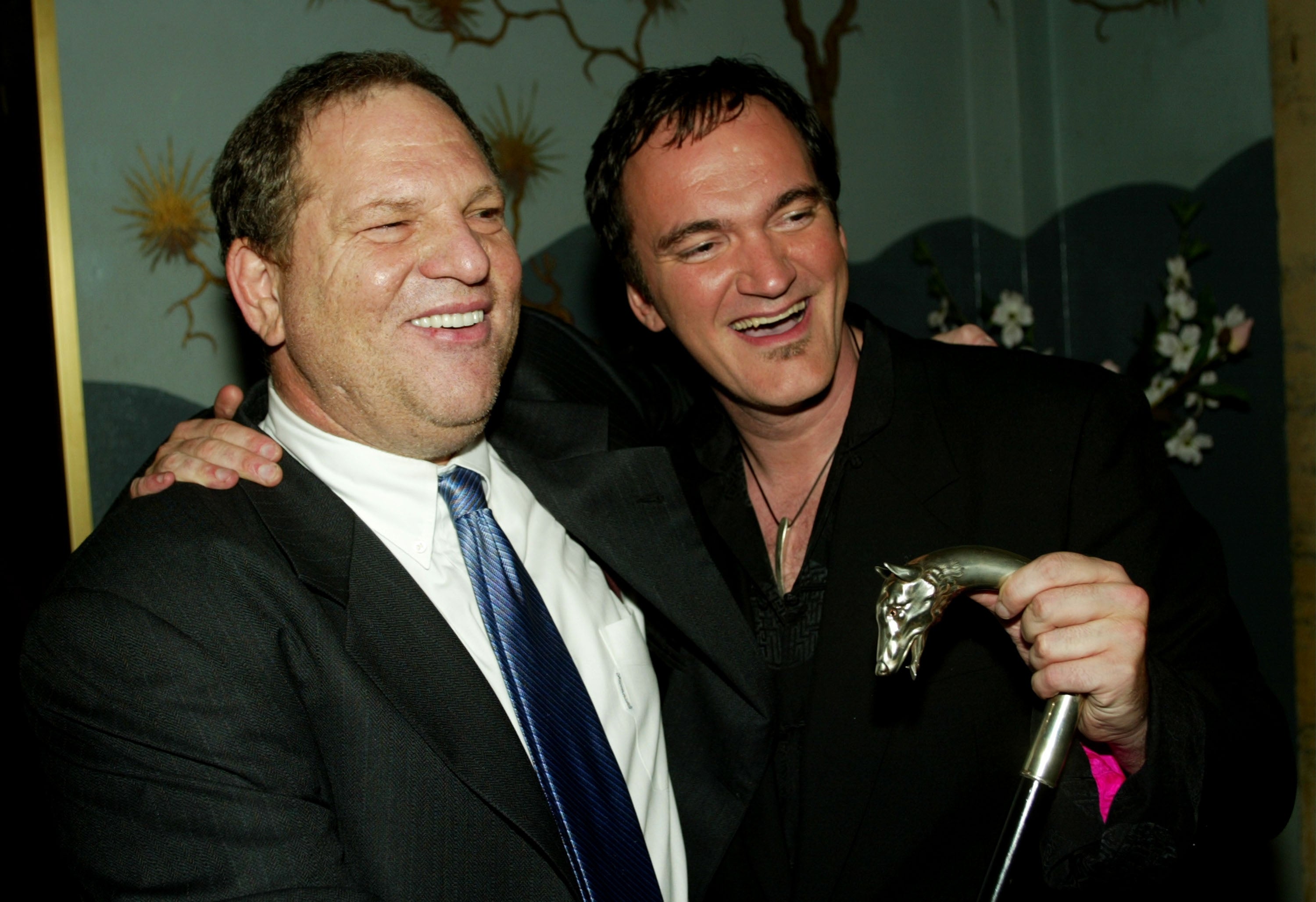 Harvey Weinstein and director Quentin Tarantino smile as they attend the Los Angeles premiere of the Miramax film "Kill Bill Volume 1"