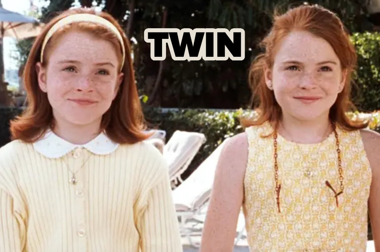 Two identical girls with red hair and freckles stand outdoors. One wears a yellow sweater; the other, a yellow patterned dress. Text above reads "TWIN."