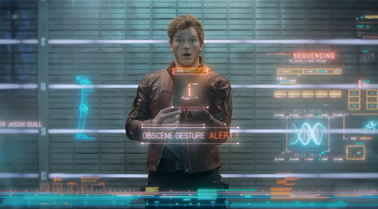 A person looks surprised in a futuristic setting with holographic displays showing text "Obscene Gesture Alert!"