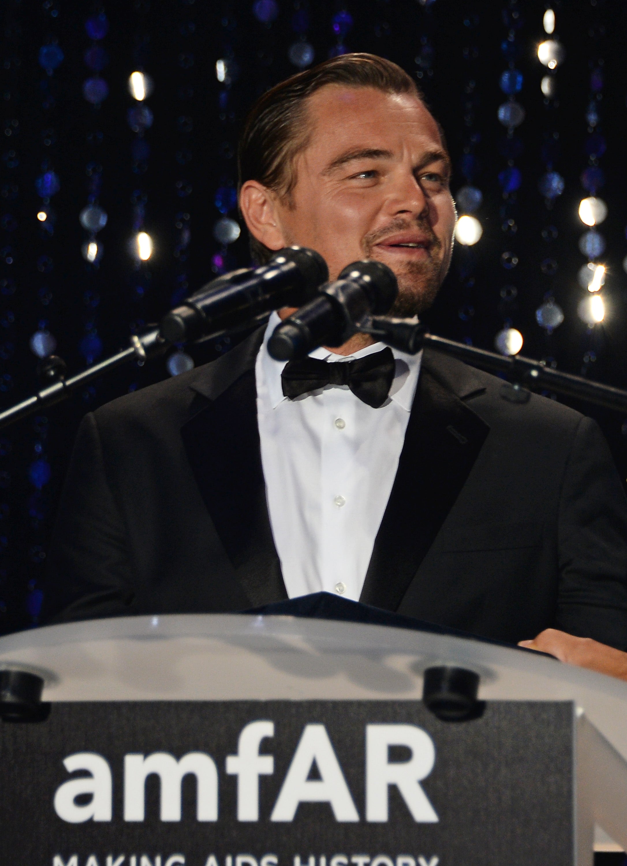 Leonardo DiCaprio speaks onstage at amfAR's 23rd Cinema Against AIDS Gala at Hotel du Cap-Eden-Roc