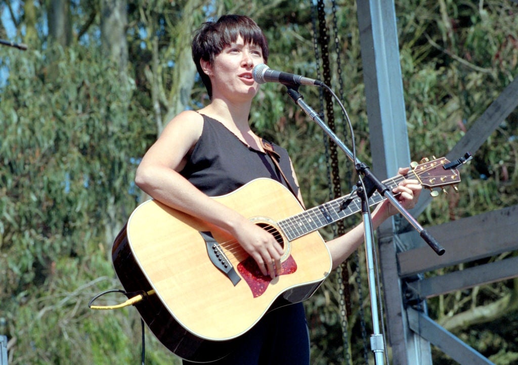 guitar and singing into a microphone