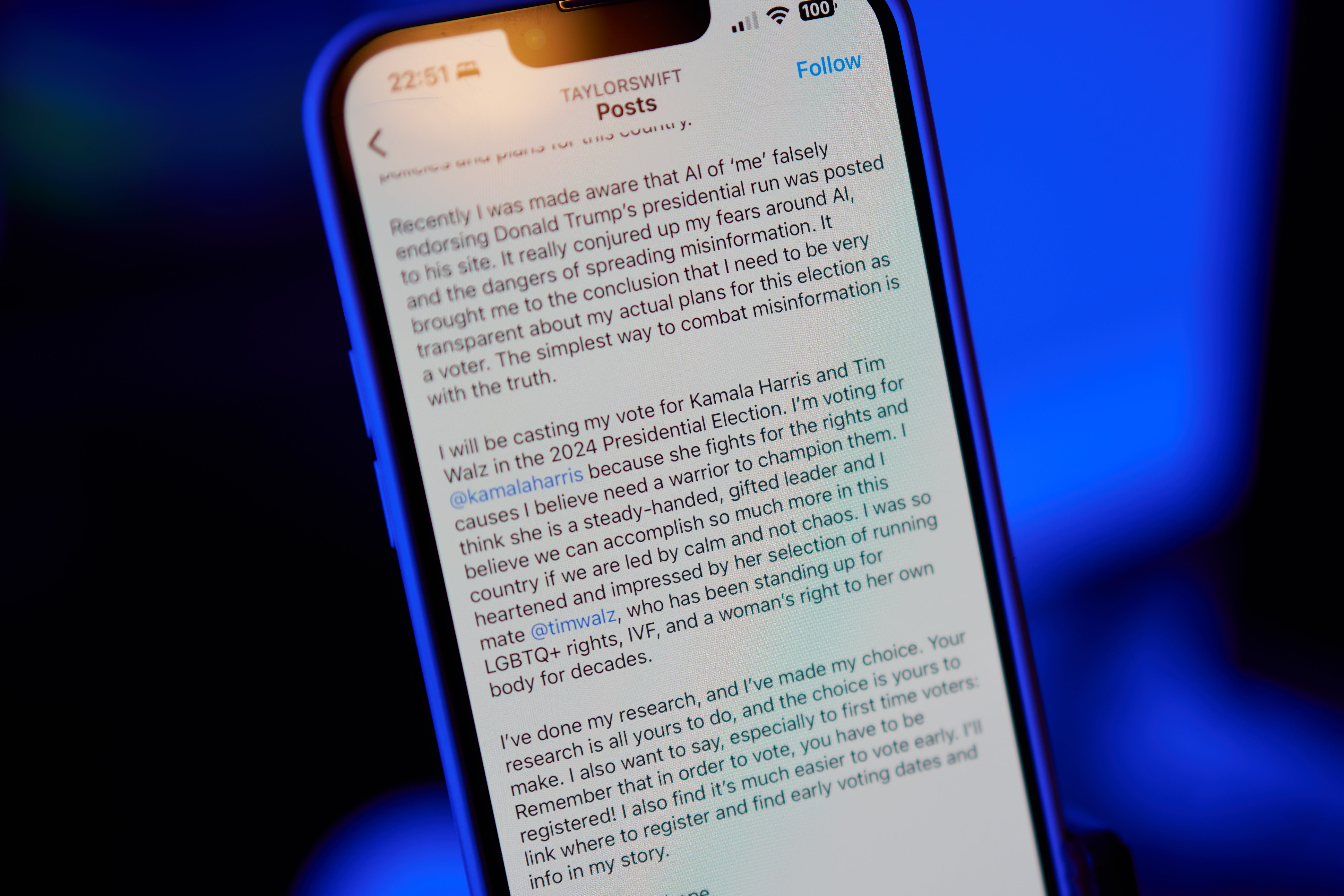 A phone screen showing Taylor Swift's text post about voting for Kamala Harris and Tim Walz in the 2024 presidential election.