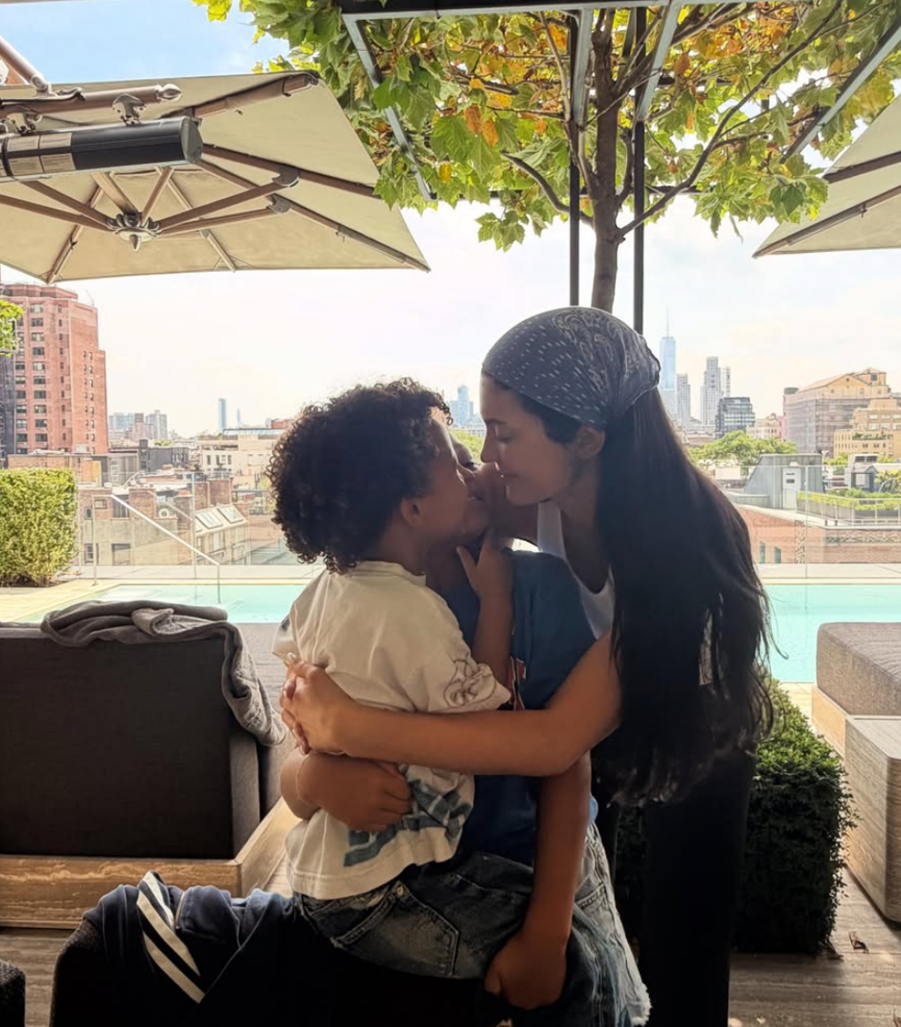Kylie embracing her kids