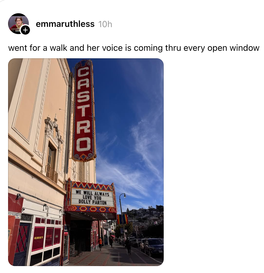 A theater with a marquee reading "We will always love you, Dolly Parton."