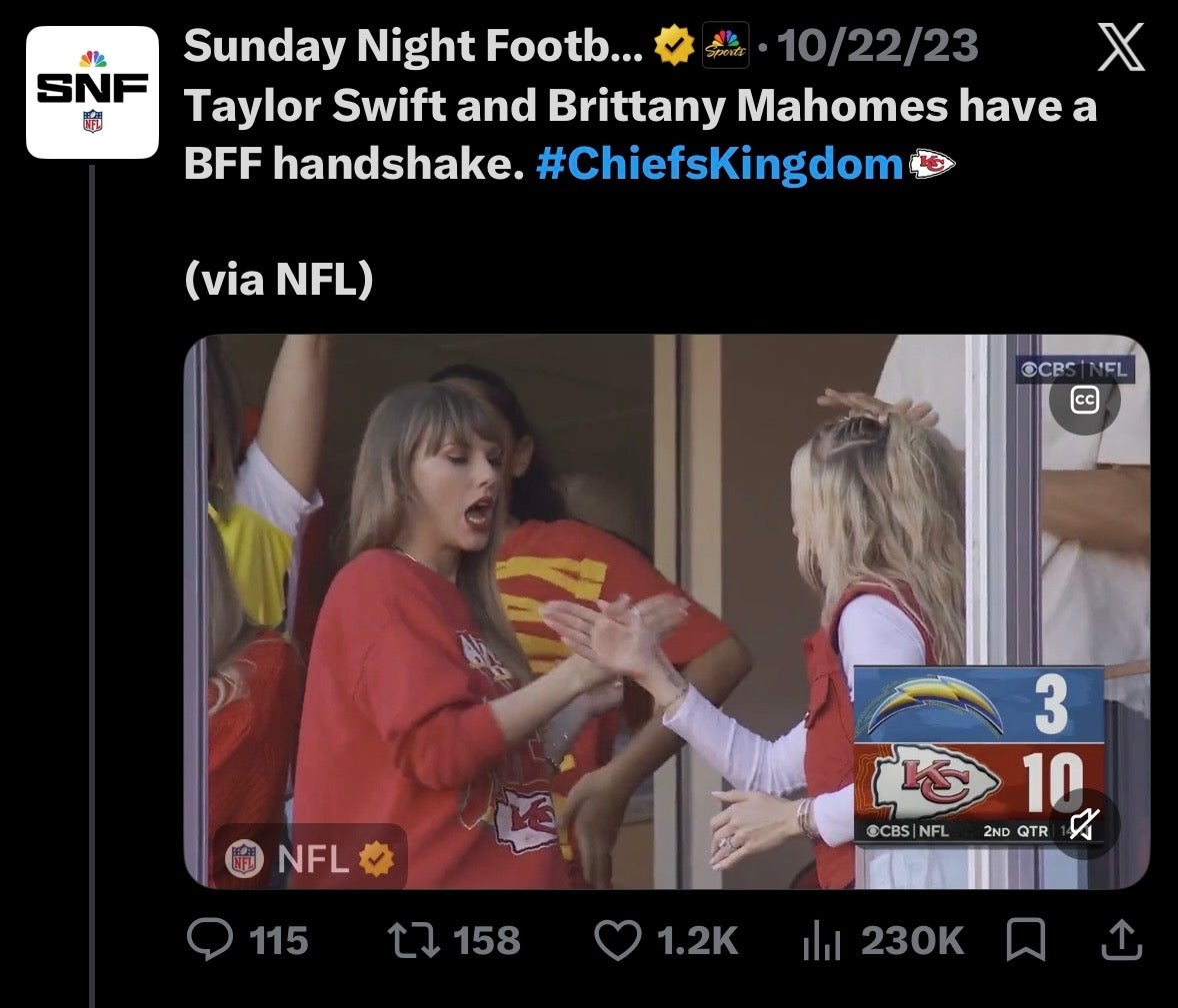 Taylor Swift and Brittany Mahomes enthusiastically share a handshake at a Chiefs football game.